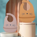 Babador - Pega Migalhas - "Refeições mais limpas e divertidas para toda a família."