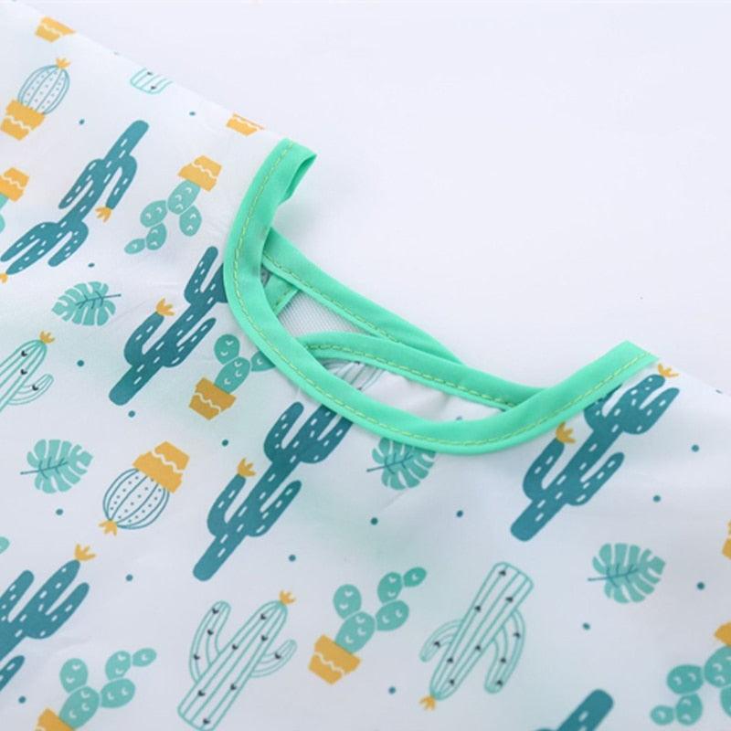 Avental de manga comprida para bebês - Proteja a roupa do seu bebê com muito mais estilo!"